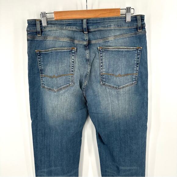 ASOS DESIGN skinny jeans in tinted mid wash with knee rips Size 32x34 - Picture 4 of 8